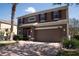 Desirable two-story home with brick driveway, two-car garage, solar panels, and lush landscaping at 535 Belle Fern Ct, Ocoee, FL 34761