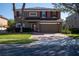 Beautiful two-story home featuring brick driveway, two-car garage, solar panels and manicured landscaping at 535 Belle Fern Ct, Ocoee, FL 34761