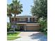 Attractive two-story home showcasing a brick driveway, two-car garage and well-manicured landscaping at 535 Belle Fern Ct, Ocoee, FL 34761