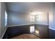 Spacious living room with dark wood floors, gray walls, and neutral trim at 535 Belle Fern Ct, Ocoee, FL 34761
