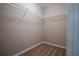 Walk-in closet featuring neutral carpet, painted walls, and wire shelving for organized storage at 535 Belle Fern Ct, Ocoee, FL 34761