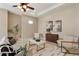 Cozy living room with neutral tones and a decorative ceiling fan at 5532 Black Hawk Ln, Lakeland, FL 33810