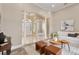 Elegant interior view with modern decor, wood flooring, and decorative arches leading to the home's entryway at 5532 Black Hawk Ln, Lakeland, FL 33810