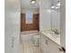 Cozy bathroom featuring tiled shower over tub with updated sink and vanity at 5825 Hafer Ln, Orlando, FL 32808