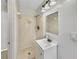 Bathroom featuring a tiled shower stall and a vanity with a sink and mirror at 5825 Hafer Ln, Orlando, FL 32808
