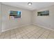 Bedroom features ceramic tile floors and two windows providing natural light at 5825 Hafer Ln, Orlando, FL 32808
