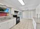 Bright kitchen with white cabinets, granite countertops, and stainless steel appliances at 5825 Hafer Ln, Orlando, FL 32808