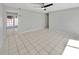 Spacious living room features neutral paint, a ceiling fan, and ceramic tile flooring at 5825 Hafer Ln, Orlando, FL 32808