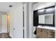 Hallway view of updated bathroom with modern vanity at 6178 Westgate Dr # 304, Orlando, FL 32835