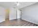 Bright bedroom with hardwood floors and an open doorway at 6178 Westgate Dr # 304, Orlando, FL 32835