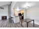 The kitchen overlooks the living room with black appliances and wood cabinets at 6178 Westgate Dr # 304, Orlando, FL 32835
