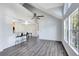 Bright open living room featuring vaulted ceilings, bar seating, and natural light at 6178 Westgate Dr # 304, Orlando, FL 32835