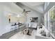Stylishly staged living room with vaulted ceilings and open concept design at 6178 Westgate Dr # 304, Orlando, FL 32835