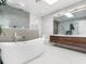 Luxurious bathroom with a soaking tub, modern fixtures, and a spacious layout filled with natural light at 641 Lake Catherine Dr, Maitland, FL 32751