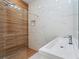 Updated bathroom with a modern shower, sleek vanity, and elegant tile work at 641 Lake Catherine Dr, Maitland, FL 32751