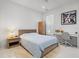 Comfortable bedroom featuring a wooden bed frame, bright desk area, and stylish decor at 641 Lake Catherine Dr, Maitland, FL 32751