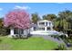 Stunning modern home with a pristine pool, lush green lawn, and beautiful landscaping at 641 Lake Catherine Dr, Maitland, FL 32751