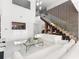 Modern living room with a statement staircase and bright, open layout at 641 Lake Catherine Dr, Maitland, FL 32751