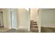 Inviting entryway with modern flooring and a staircase leading to the upper level of the home at 658 Olympic Dr, Ocoee, FL 34761