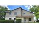 Charming two-story home with neutral siding and well-maintained landscaping in a suburban setting at 658 Olympic Dr, Ocoee, FL 34761