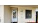 Welcoming front entryway with a glass paneled door and adjacent window providing ample natural light at 658 Olympic Dr, Ocoee, FL 34761