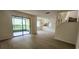 Bright living room featuring an open floorplan, wood flooring and a sliding glass door at 658 Olympic Dr, Ocoee, FL 34761