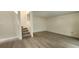 Bright living room with wood flooring and stairs to the second level at 658 Olympic Dr, Ocoee, FL 34761