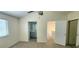 Bright main bedroom with a ceiling fan, vaulted ceiling, and convenient access to the bathroom at 658 Olympic Dr, Ocoee, FL 34761