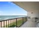 Relaxing balcony with ocean views, featuring tile flooring and comfortable seating at 6727 Turtlemound Rd # 417, New Smyrna Beach, FL 32169