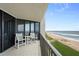 Enjoy ocean views from the balcony featuring tile floors and seating at 6727 Turtlemound Rd # 417, New Smyrna Beach, FL 32169