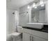 Modern bathroom features updated vanity, granite countertop, and shower at 6727 Turtlemound Rd # 417, New Smyrna Beach, FL 32169