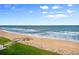 Scenic view of the beach and ocean, with stairs leading to the beach at 6727 Turtlemound Rd # 417, New Smyrna Beach, FL 32169