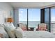 Light and airy bedroom with ocean view and sliding doors to the balcony at 6727 Turtlemound Rd # 417, New Smyrna Beach, FL 32169