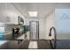 Clean kitchen with stainless steel appliances, white cabinets, and granite counters with tiled backsplash at 6727 Turtlemound Rd # 417, New Smyrna Beach, FL 32169