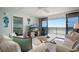 The living room offers views of the balcony and nearby bedroom at 6727 Turtlemound Rd # 417, New Smyrna Beach, FL 32169
