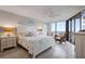 Inviting main bedroom with ocean view, ceiling fan, and beach-themed decor at 6727 Turtlemound Rd # 417, New Smyrna Beach, FL 32169