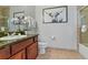 Nicely decorated bathroom featuring a single vanity, granite countertop, toilet, and a shower-tub combination at 8000 Tuscany Way # 4405, Davenport, FL 33896