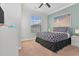Inviting bedroom with patterned bedding, a large window, and modern decor at 8000 Tuscany Way # 4405, Davenport, FL 33896