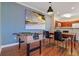 Open concept dining area with foosball table, connected to the kitchen at 8000 Tuscany Way # 4405, Davenport, FL 33896