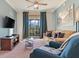 Comfortable living room with modern decor and a sliding glass door to balcony at 8000 Tuscany Way # 4405, Davenport, FL 33896
