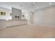 Large bonus room with built-in cabinets, neutral carpet, and natural light from the windows at 8149 Via Vittoria Way, Orlando, FL 32819