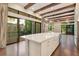 Island kitchen flows seamlessly into the living and dining areas, and features lots of natural light at 8149 Via Vittoria Way, Orlando, FL 32819