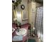 Bathroom featuring a countertop sink, storage cabinets, and a shower with a patterned curtain at 103 Dreama Dr, Davenport, FL 33897