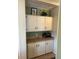 Functional butlers pantry with ample storage cabinets and counter space at 103 Dreama Dr, Davenport, FL 33897