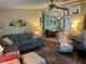 Comfortable living room with a ceiling fan, hardwood floors, and stylish furniture at 103 Dreama Dr, Davenport, FL 33897