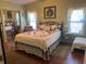 Comfortable bedroom featuring a bed with a quilt and a mirrored closet at 103 Dreama Dr, Davenport, FL 33897