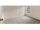 Cozy bedroom with neutral carpet, bi-fold closet, and a bright window view at 113 Glasgow Ct, Davenport, FL 33897