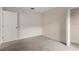 Neutral bedroom featuring carpeted floors and a closet with a simple, clean design at 113 Glasgow Ct, Davenport, FL 33897