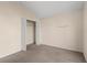 Neutral bedroom featuring carpeted floors and a closet with a simple, clean design at 113 Glasgow Ct, Davenport, FL 33897