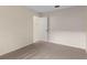 Bedroom with neutral carpet and an open doorway at 113 Glasgow Ct, Davenport, FL 33897